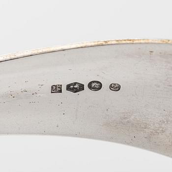 Serveringsbestick, 3 st, silver, Holland 1883-1975, och ostknappar, silver, Finland 1971.