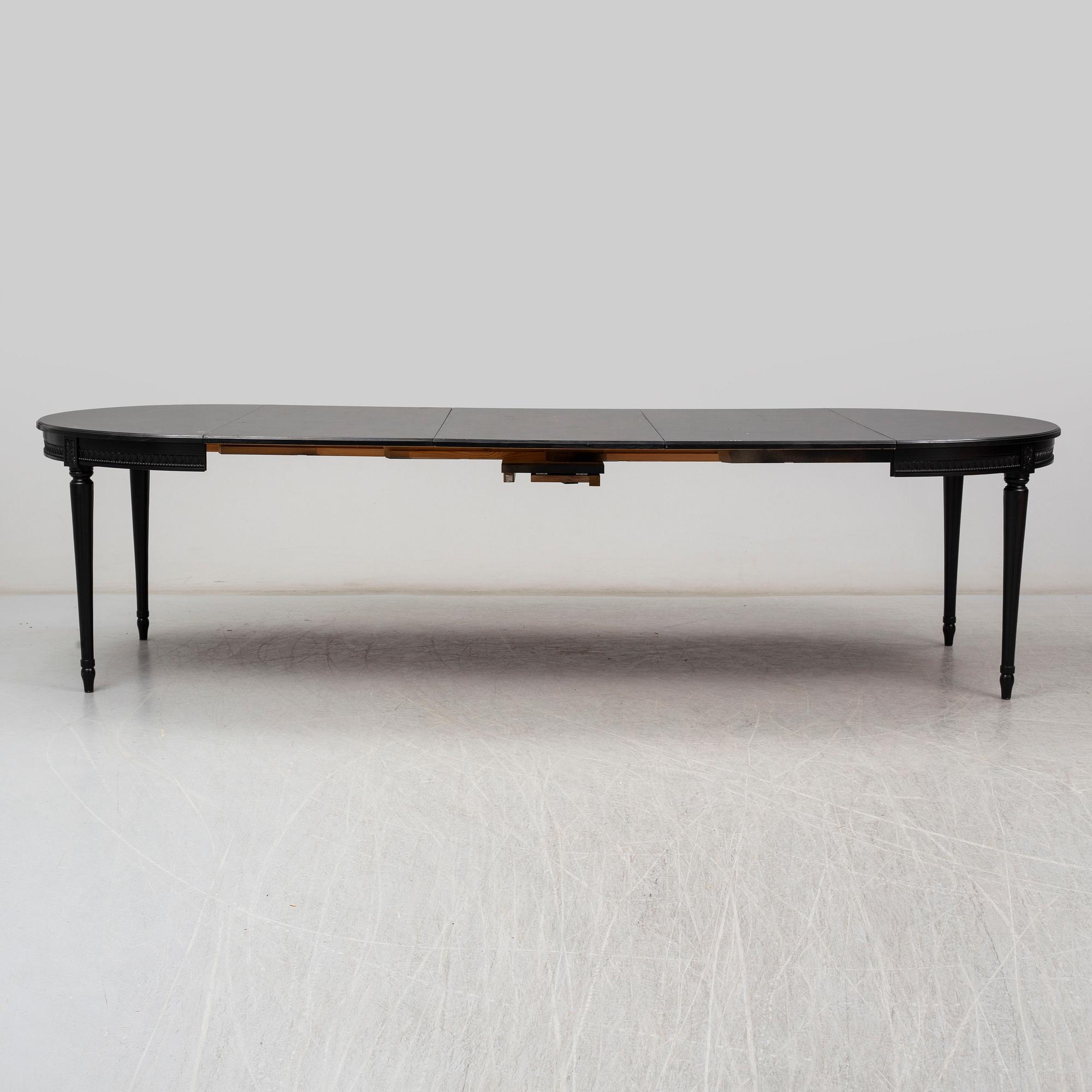 A late 20th Century painted table.