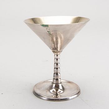 A set of 12 silver plated cocktail glasses and a shaker mark By CG Hallberg Stockholm mid 1900s.