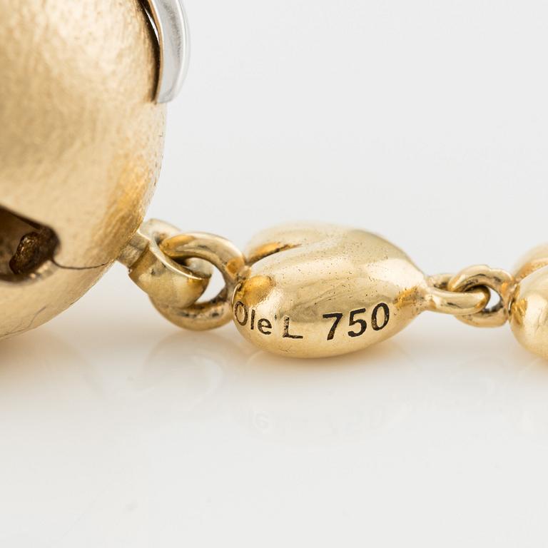 Ole Lynggaard, lås 18K guld med briljantslipad diamanter, med hänge i form av nyckel med hjärtan.