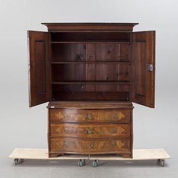 An 18th century oak and walnut cabinet.