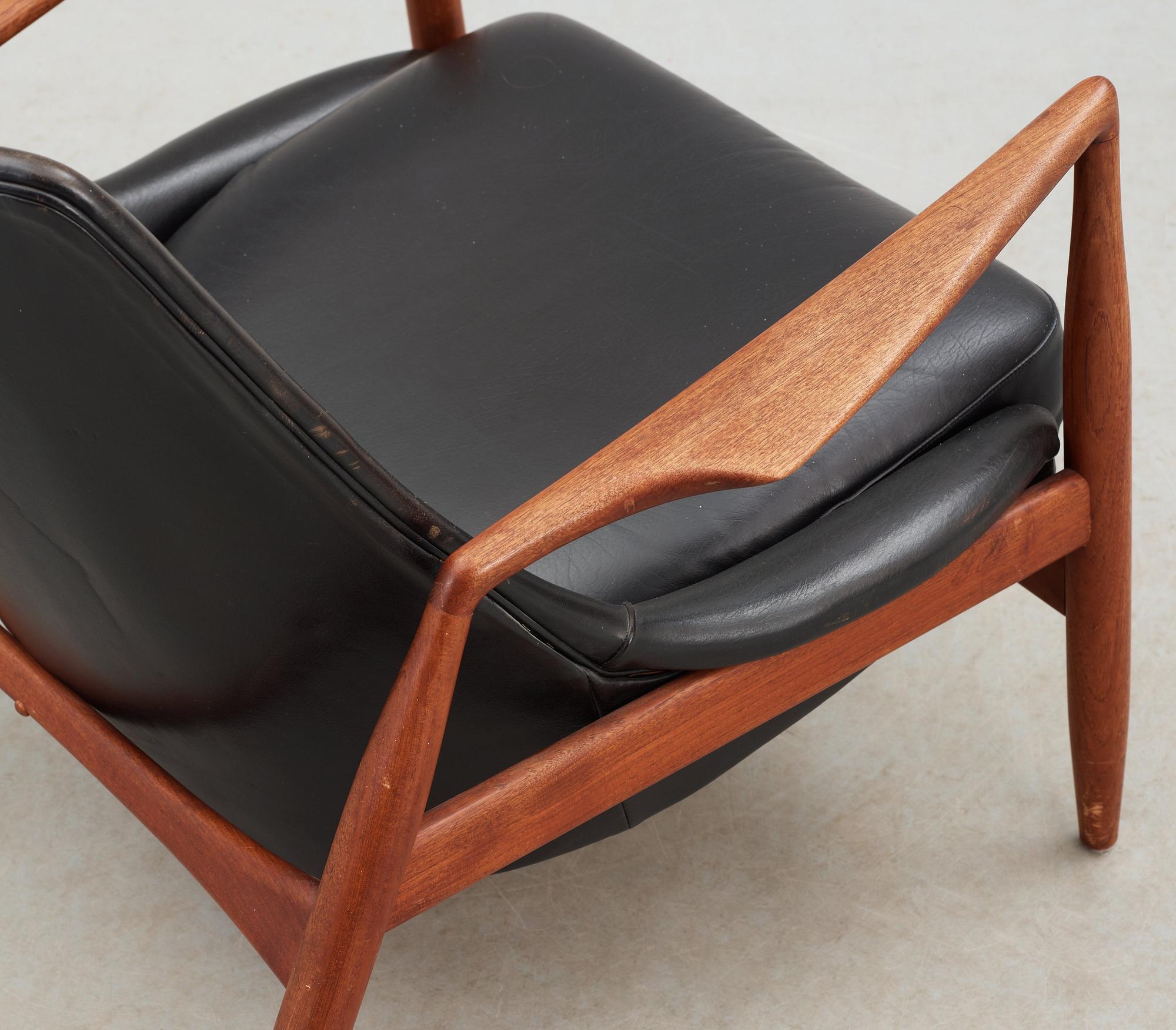 An Ib Kofod Larsen black leather and teak easy chair 'The Seal' by OPE, Sweden 1950-60's.