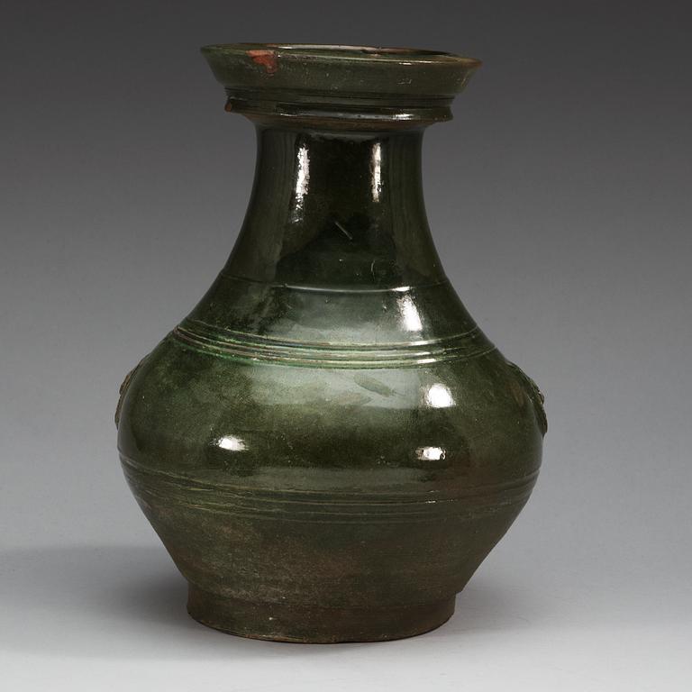 A green glazed jar, Han dynasty (206 BC - 220 AD).