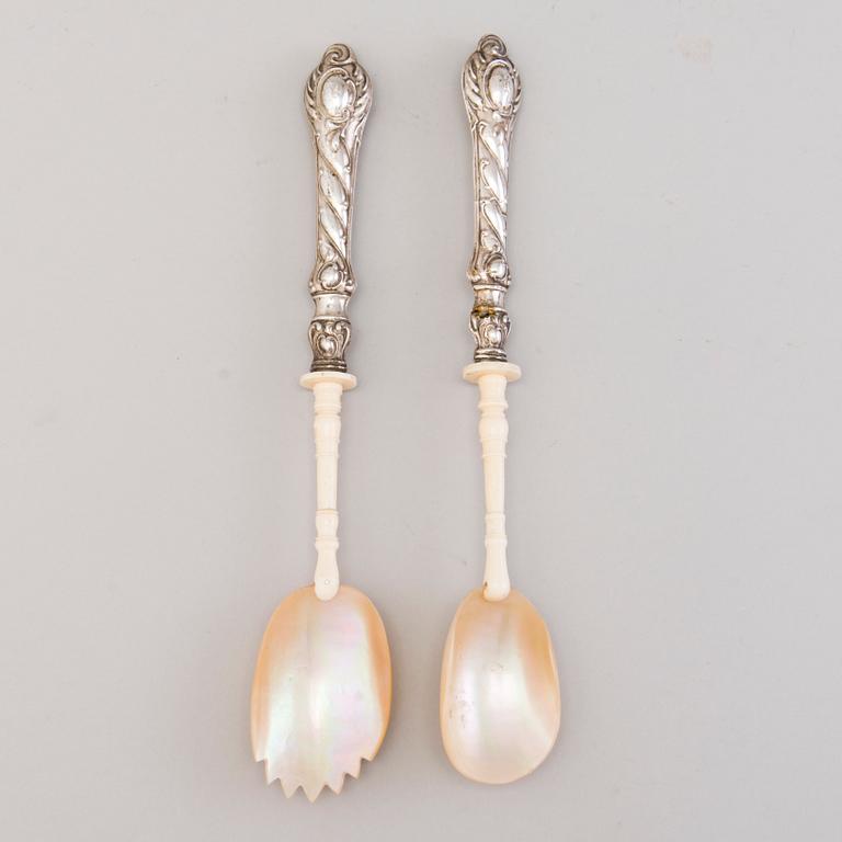 A pair of 19th Century salad servers in silver, mother of pearl and bone. In original wooden box.