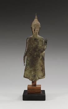A slender bronze figure of Buddha, holding the left hand in Abhaya muddra, Thailand, 18/19th Century.