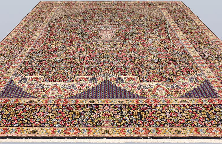 A Kerman Laver carpet, 'Millefleur', c. 392 x 300 cm.