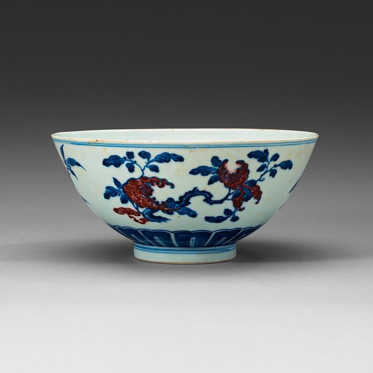 A blue, white and red bowl, late Qing dynasty with Qianlong seal mark.