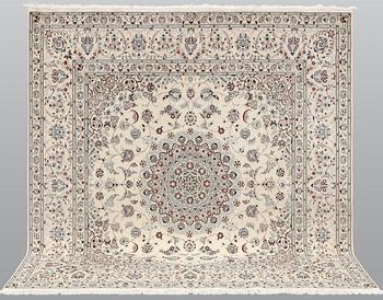 A Nain carpet, part silk, so called 6LAA, approximately 207 x 208 cm.