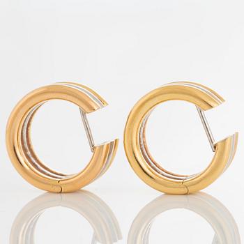 A pair of earrings in 18K tri-colour gold.