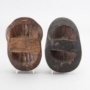 Two wooden sculptures in the shape of theatre masks, Japan, 20th Century.