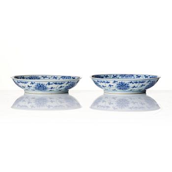 A pair of blue and white 'lotus' dishes, Qing dynasty with Daoguang mark and of the period (1821-50).