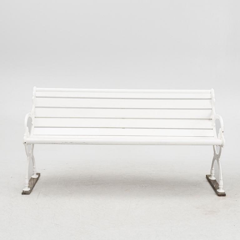 A cast iron garden bench, 20th century.