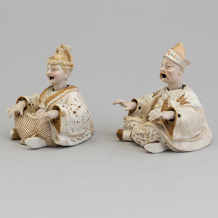 A pair of Chinese style 20th century porcelain nodding figures.
