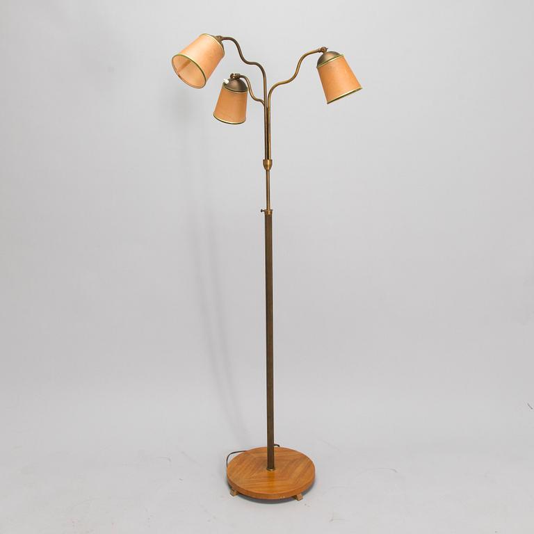 A brass floor lamp, mid-20th century.