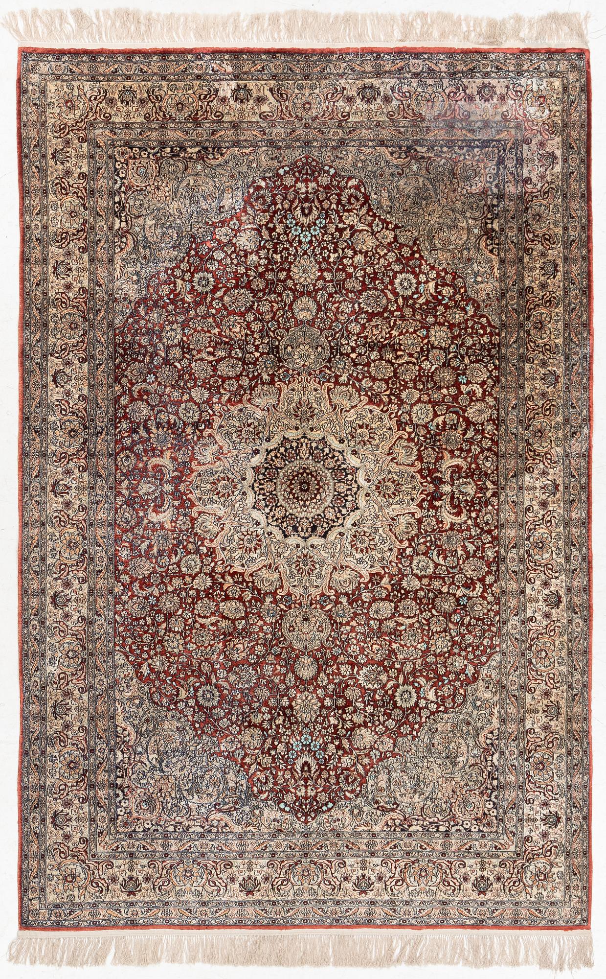 Carpet, part silk, approx. 240 x 158 cm.