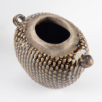 A green glazed jar and an olive glazed pot with handles, Qing dynasty, 19th Century.