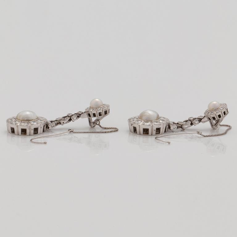 A pair of probably natural saltwater pearl, cultured pearl and brilliant cut diamond earrings.