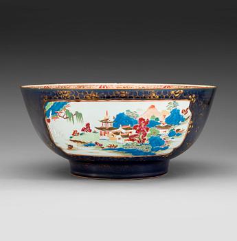 219. A powder blue and famille rose punch bowl, Qing dynasty, Qianlong (1736-95).