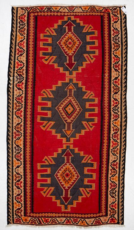 A Kilim rug, c. 300 x 165 cm.