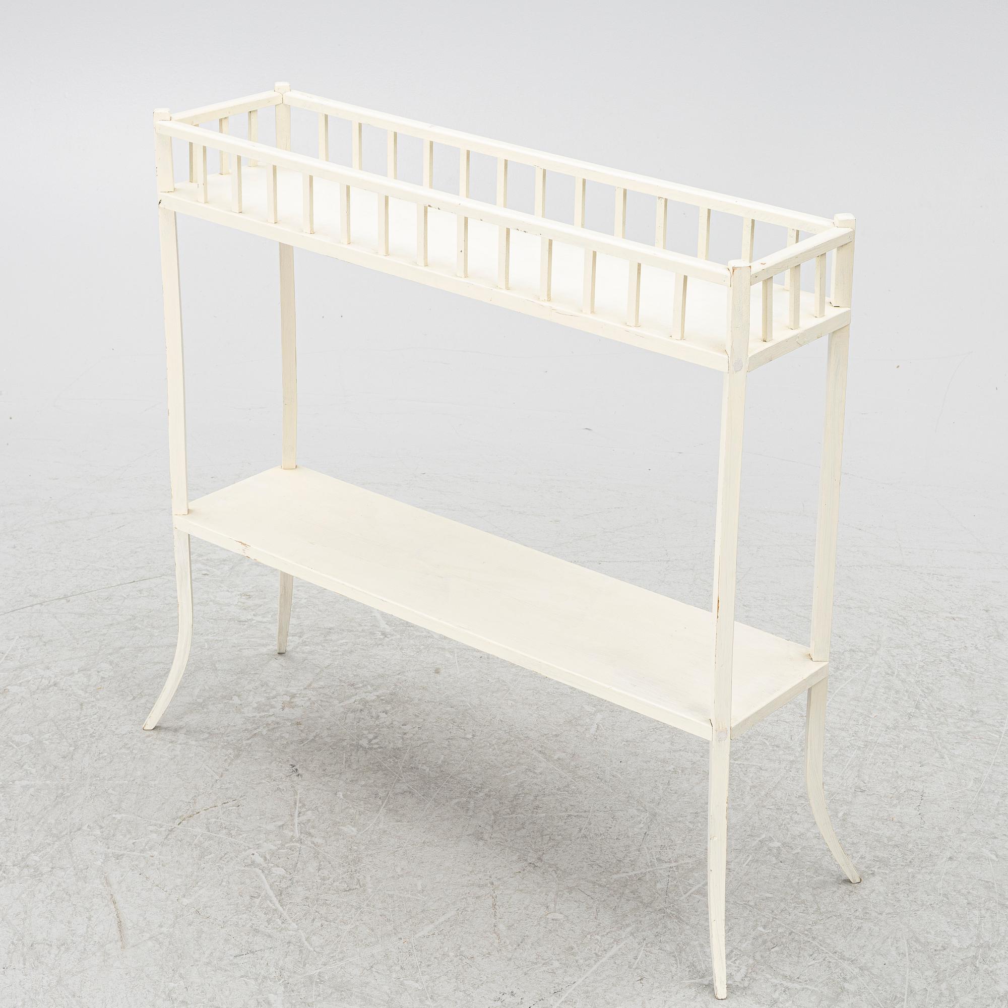 A plant stand, circa 1900.