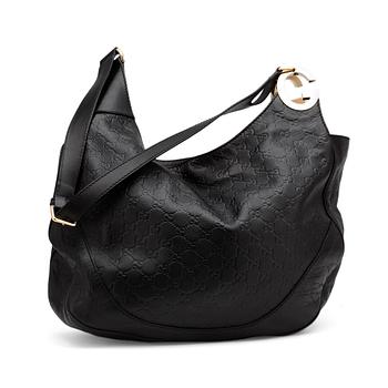 637. GUCCI, a black monogrammed leather shoulder bag.