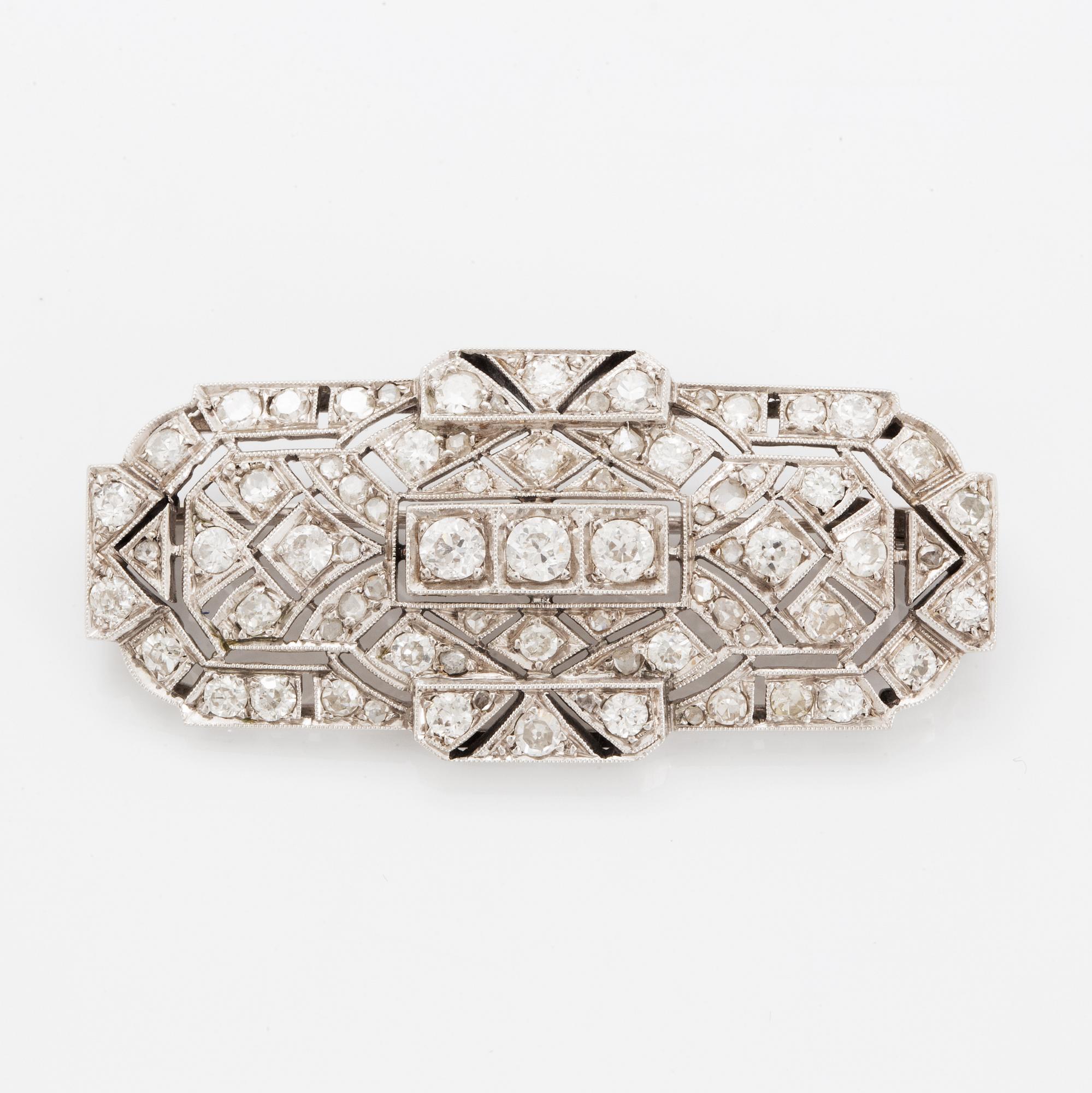 Rintaneula, 14 valkokultaa, vanhahiottuja ja ruusuhiottuja timantteja. n. 2.40 ct yht.