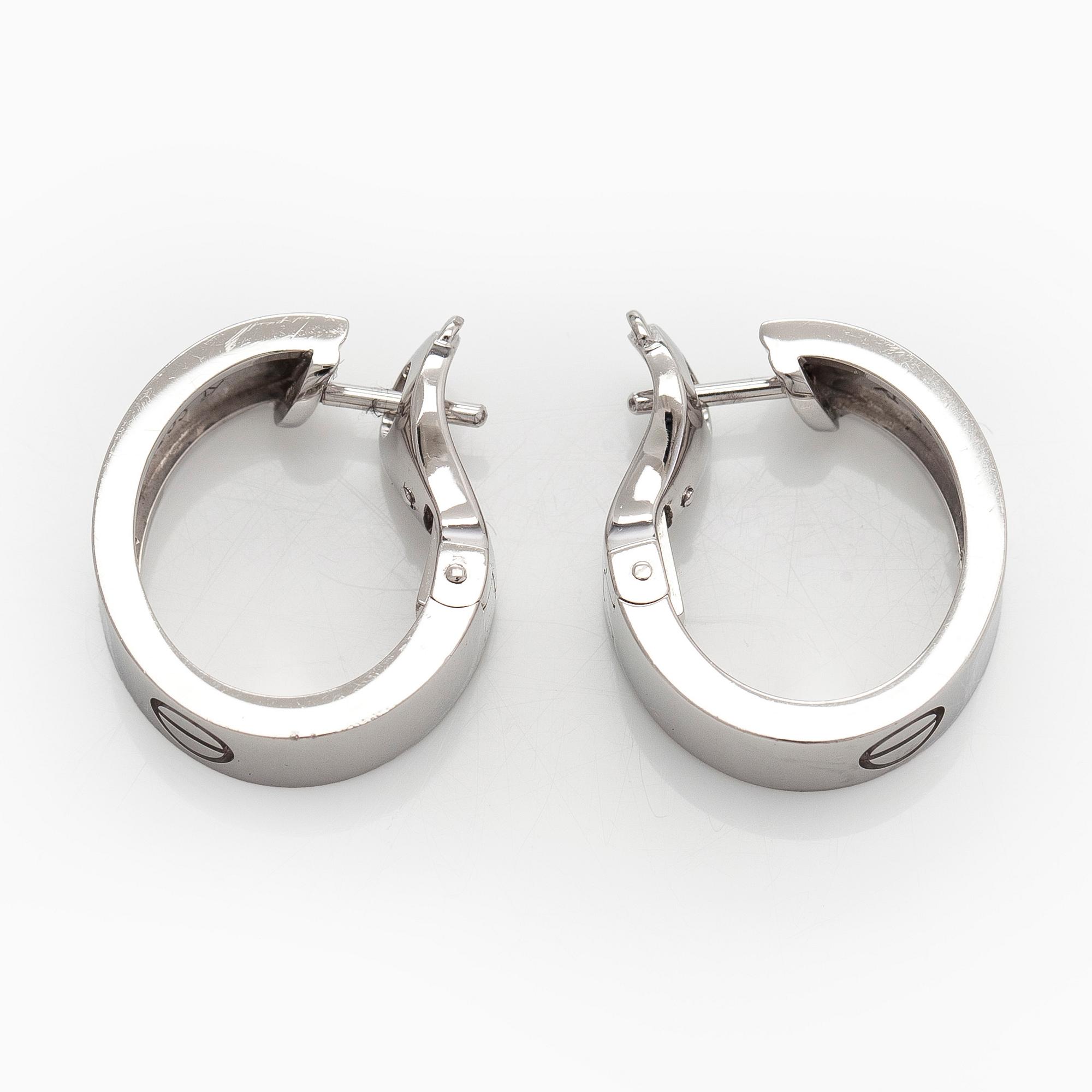 Cartier, Korvakorut, "Love", 18K valkokultaa, briljanttihiottuja timantteja.