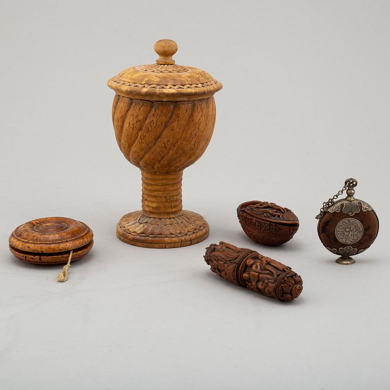 Five carved wood items, including a cup and a miniature bottle, 19th century.