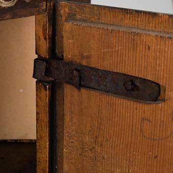 A 19th century corner cabinet.