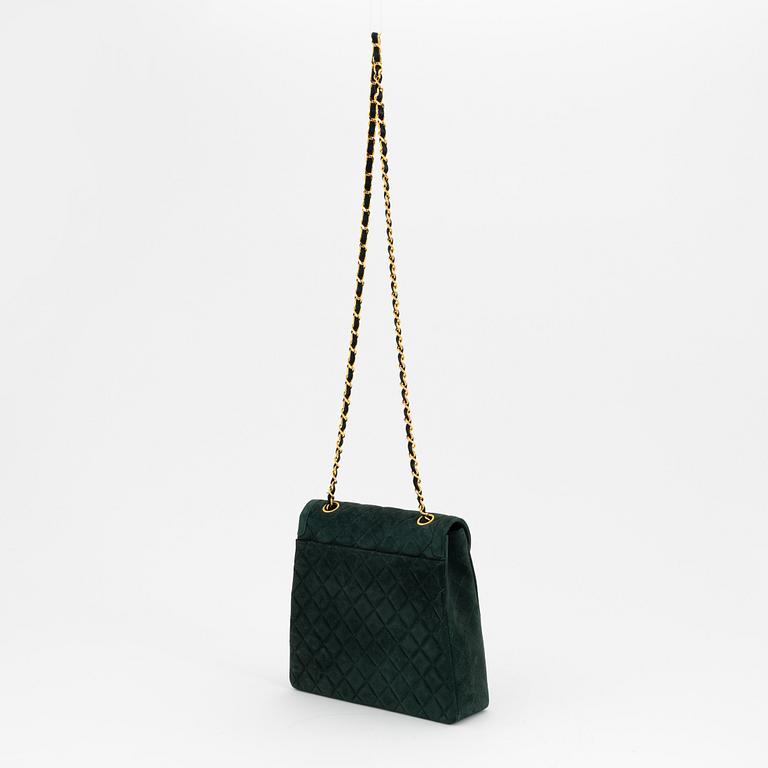 Chanel, a green suede bag with pouch, 1989-1991.