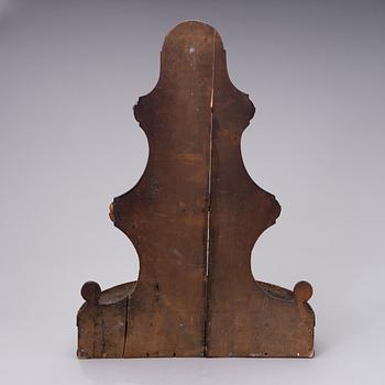 19th century pipes on a wooden pipe rack.