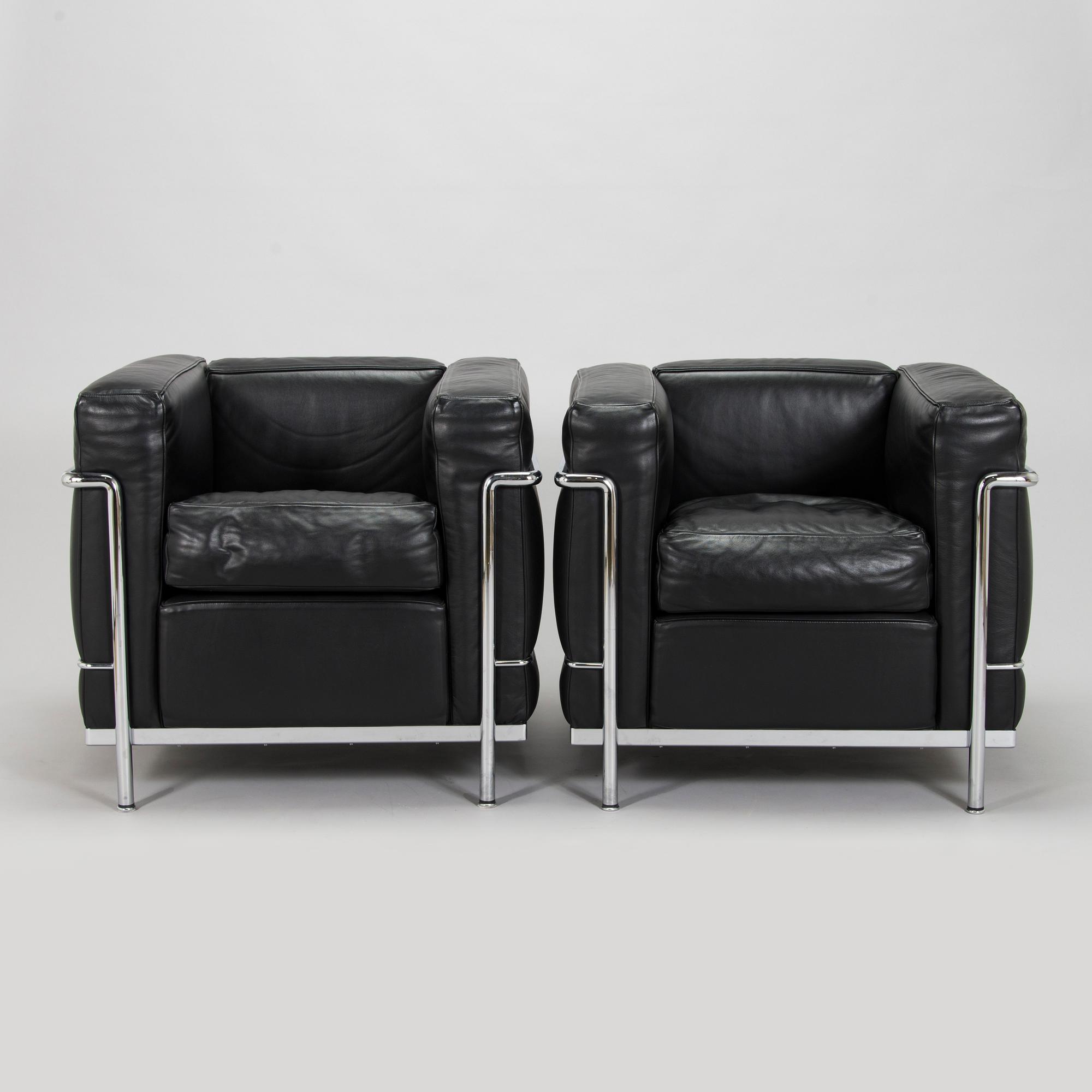 Pierre Jeanneret, Charlotte Perriand & Le Corbusier, a pair of 'LC2' armchairs, Cassina, Italy.