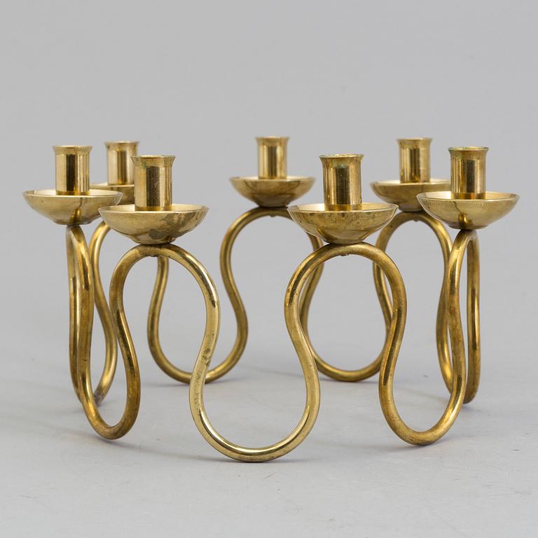 A Lars Holmström brass candle holder for seven candles, Svenskt Tenn, second half of the 20th century.