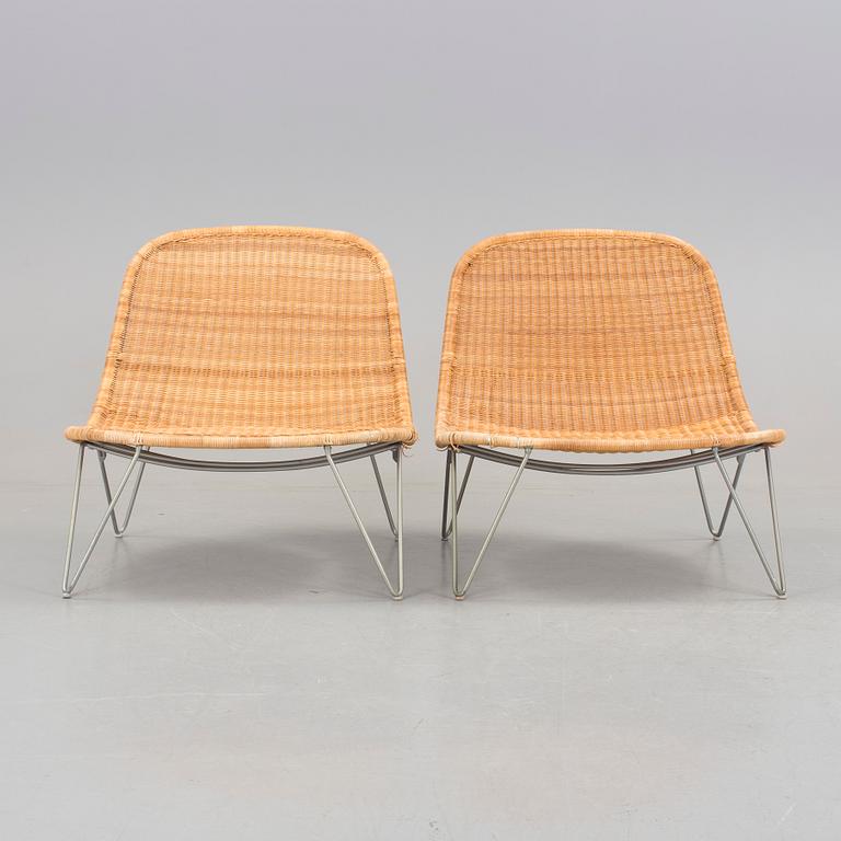 a pair of 21h Century lounge chairs designed by James Irvine, by IKEA.