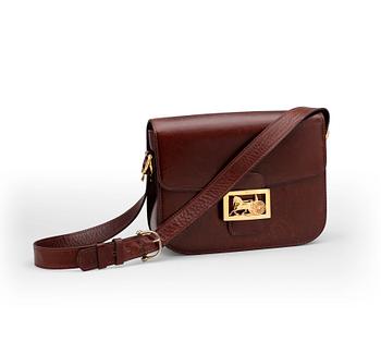 CÉLINE, a red leather shoulder bag.