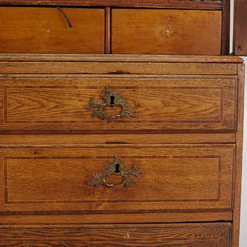 An oak rococo cabinet, mid 18th Century.