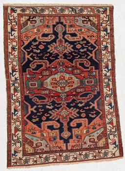 A Heriz rug, c. 192 x 133-139 cm.