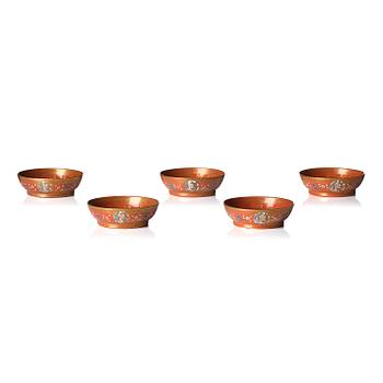 1017. A group of five coral-red-ground famille-rose 'Imperial wedding' wares, Qing dynasty, Tongzhi period.