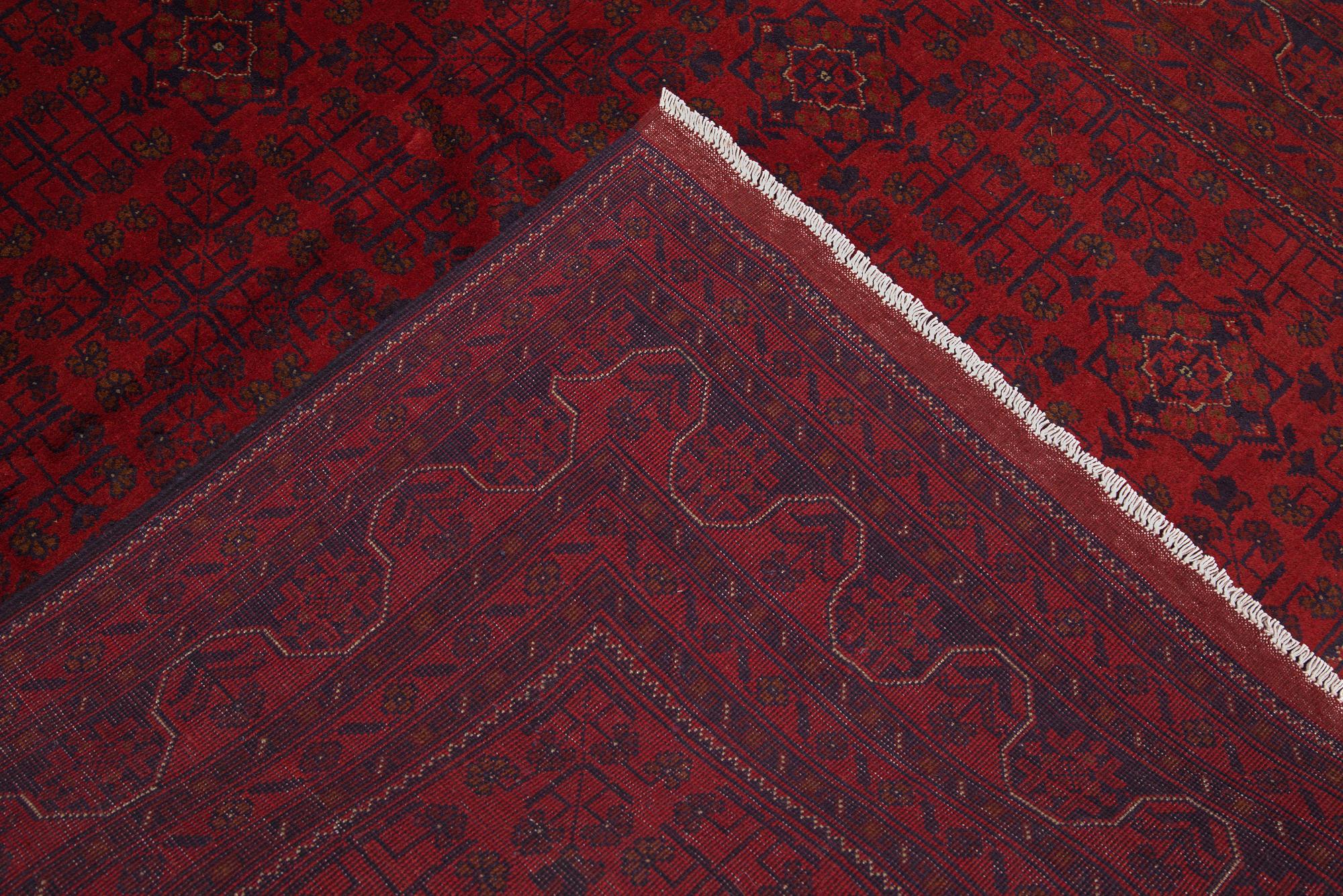 A Afghan carpet, 232 x 167 cm.