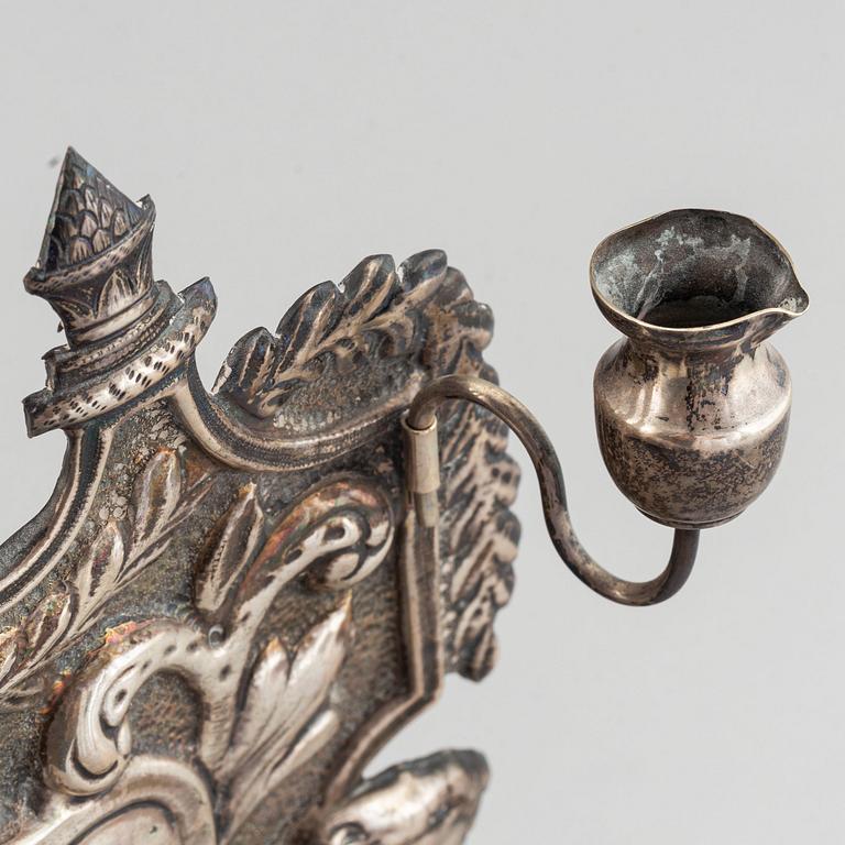 A 19th century silver chanukka-lamp.