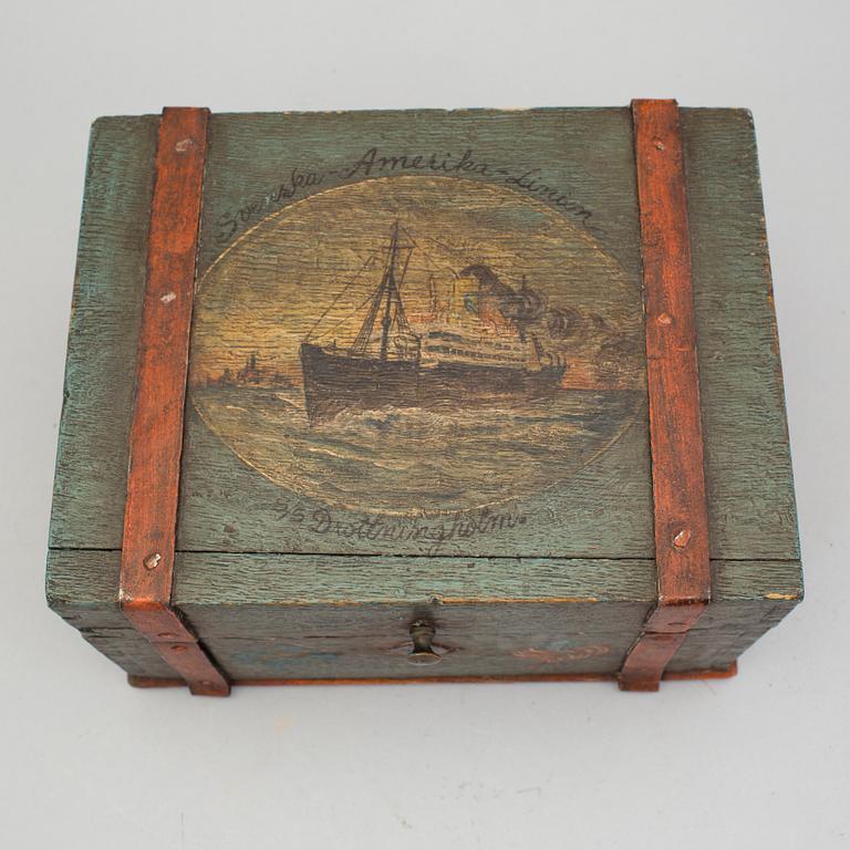 A painted box with motif from the Swedish American Line early 20th century.