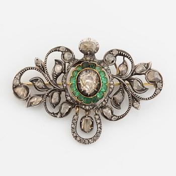 Gold and silver with rose cut diamond and emerald brooch.