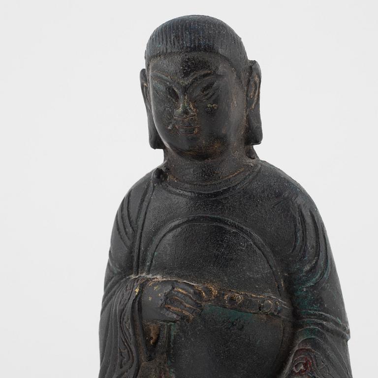 A bronze sculpture of a seated deity, Ming style, probably 20th Century.
