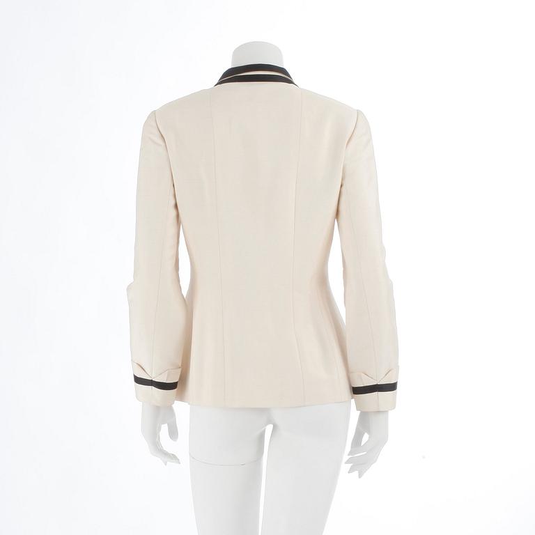 CHANEL, a black and white silk jacket.