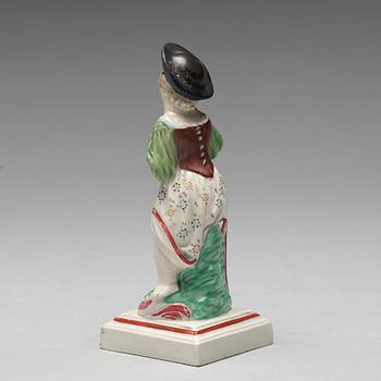 An English creamware figure representing Autumn, circa 1800.