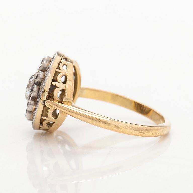 An 18K gold ring, set with old- and single-cut diamonds.