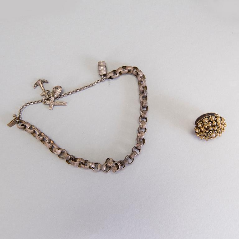 A collection of mostly silver, tradition folk buttons and belt buckles.