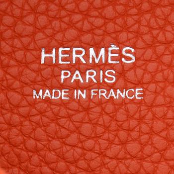 HERMÈS, a orange leather handbag, "Picotin lock".