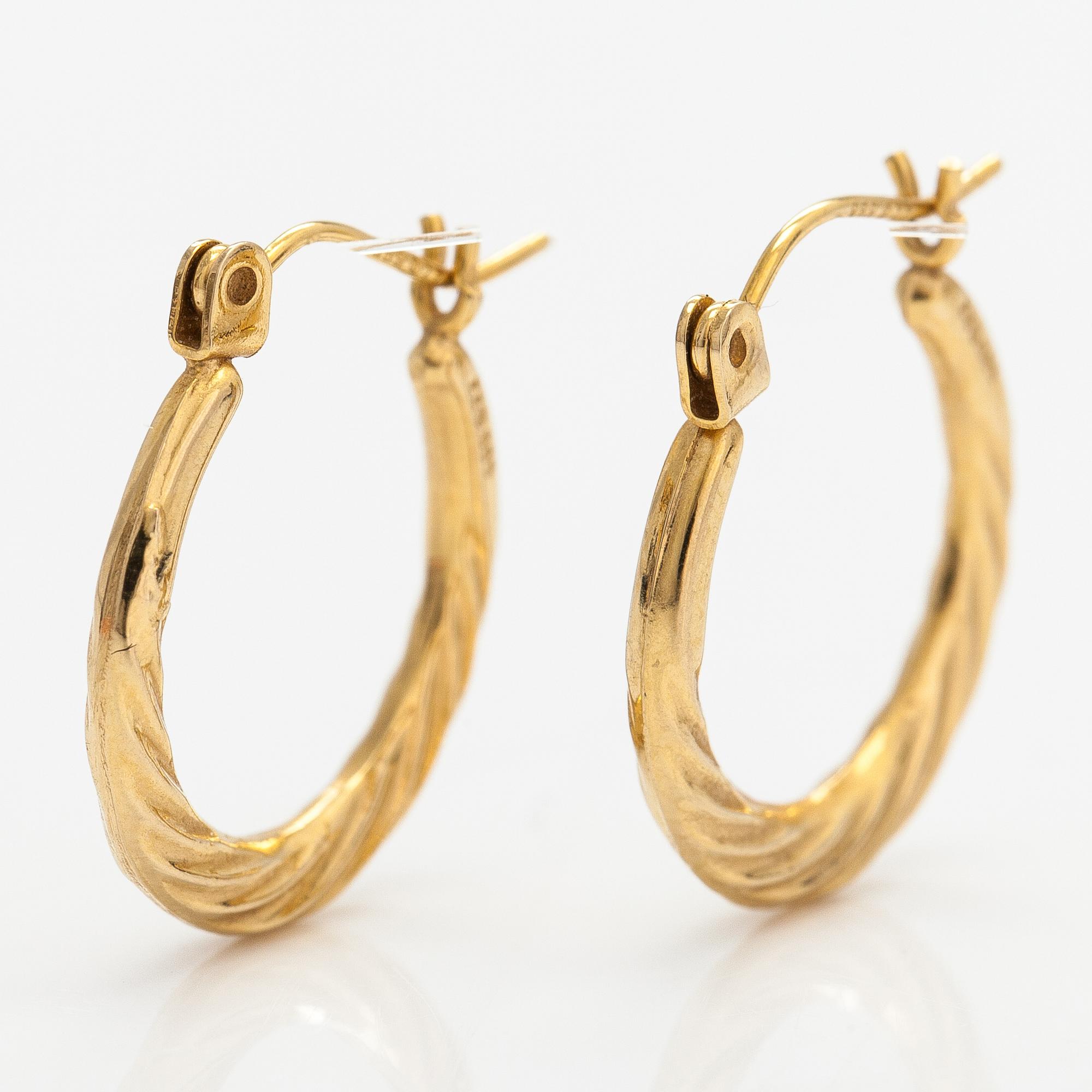A pair of 14K gold earrings.