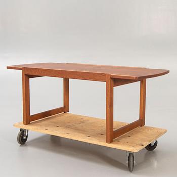 A 1960s, probably Danish teak and oak coffee table.